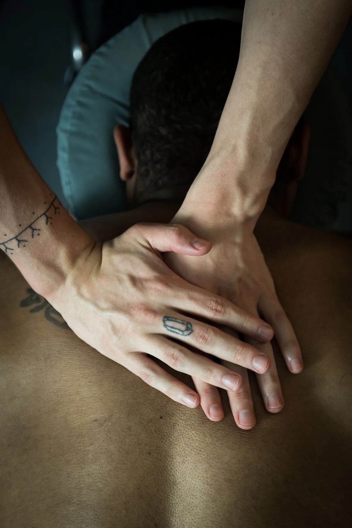 A client receiving an attentive massage session at Fusion Bodyworks