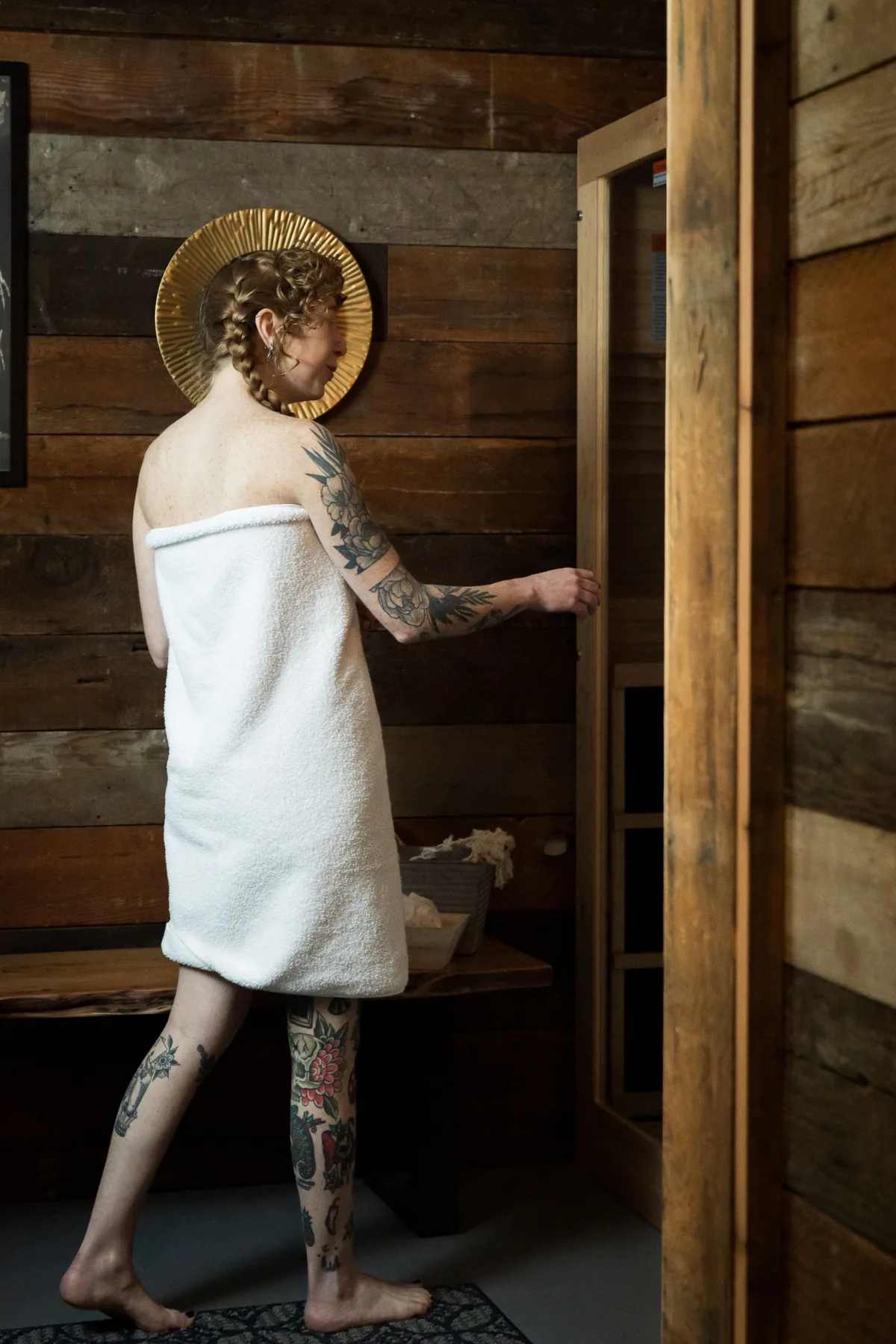A guest in a towel preparing to enter the sauna